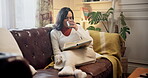 Woman, coffee and reading book to relax in home, literature and fiction novel with matcha for peace. Female person, drinking tea and rest with fantasy story in living room, hot espresso and page