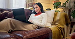 Laptop, relax and woman on sofa in home proofreading online article for publishing confirmation. Happy, rest and female copywriter with email for feedback on blog post with freelance career at house.