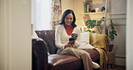 Happy, phone and woman with coffee on sofa for online chatting, social media and contact on weekend. Relax, home and person on smartphone for internet, website and communication in living room