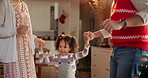 Dancing, parents and child in Christmas, playing and fun with daughter, games or relax for holiday. House, woman and man with girl, living room and love for festive, celebration and family with smile