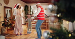 Parents, daughter and smile with dancing on Christmas at home for fun, break and celebration. People, family and happy with kid jumping in living room on festive season for unity, love and support