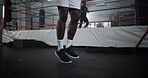 Legs, man and skipping for fitness at gym for wrestling match, workout and professional competition of power. Male boxer, jump and rope exercise for battle performance, mma energy and challenge goals