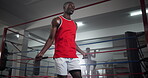 Black man, skipping and rope for fitness at gym for wrestling match, sport workout and professional competition. Male boxer, jump and cardio exercise of battle performance, energy and challenge goals