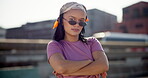Girl, fashion and arms crossed with sunglasses outdoor on city bridge for streetwear, confidence and attitude. Woman, person and portrait with edgy style in town with pride, trendy clothes or eyewear
