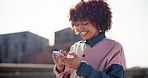 Smile, typing and woman in city, smartphone and internet with buildings, connection and mobile user. New York, person and girl with cellphone, urban town and social media with contact and chatting