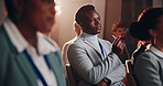 Business people, listening and night with crowd in seminar for workshop, staff training or presentation at conference. Young, group or employees in meeting, tradeshow or convention talk at workplace