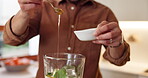 Hands, man and smoothie in blender in kitchen for breakfast drink, healthy diet and honey for nutrition. Person, nutritionist and prepare ingredients in home for protein shake, detox lunch and recipe