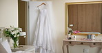 Wedding dress, interior and mirror with room for marriage, event or morning before ceremony at home. Empty space, gown and fashion with luxury outfit on door hanger in preparation for special day