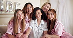 Friends, face and happy with bridal shower for celebration, announcement and cheerful in hotel bed. Group, women and bride with smile for commitment, solidarity and excitement in bachelorette party