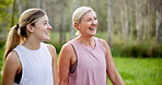 Conversation, fitness and park with mother and daughter outdoor in summer for cardio or marathon training. Exercise, laughing or walking with mature parent and woman in forest for start of workout