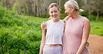 Mature mom, daughter and walking in hug with morning run, fitness and exercise in Germany. People, family and smile or happy on conversation in park with bonding, support and  jogging for health