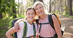 Happy woman, mother and face with travel, sightseeing or adventure in nature, park or forest. Smile, mature parent and tourist with portrait for summer, holiday or vacation in woods for bonding