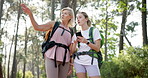 Woman, mother and phone for travel, hiking route or adventure in nature, park or forest. Directions, mature parent and tourist with smartphone for research, holiday or vacation in woods for bonding