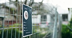 Animal shelter, cage and poster of rescue dog outdoor for adoption, community or pet ownership. Charity, fence and sign with information on enclosure at pound for activism, attention or welfare