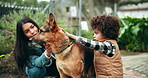 Boy, dog and mother with care at shelter with German shepherd, stroke and love for homeless pet. Child, mom and learning with charity, kindness and family at abandoned animal center in Colombia