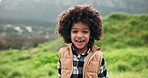 Child, face and happy in nature for travel, journey and excited for holiday in Brazil. Young boy, laugh and portrait in countryside for adventure, fun activity and weekend trip in field environment