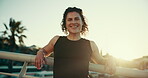 Woman, confidence and smile outdoor for fitness in morning for workout, training and exercise in Spain. Female person, face and happy with sunshine at bridge for health, self care and wellbeing