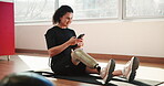 Smartphone, training and woman with prosthetic leg, smile and texting on app, communication and online. Fitness, wellness and person with disability, mobile and routine in morning and exercise