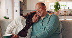 Coffee, conversation and smile with mature couple on sofa in living room of home together for bonding. Laughing, love or relax with happy man and woman in apartment for relationship or romance