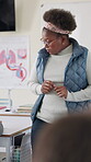 Woman, students and education as teacher in lecture or classroom for growth or development. Female person, learners and assessment for high school test or quiz with knowledge, examination and project