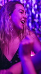 Woman, dance and excited in night club for party, celebration and happy for New Year. Friends, movement and energy on dancefloor for event, singalong or birthday social with neon lights for aesthetic