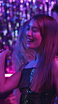 Woman, dance and energy in night club for party, celebration or excited for New Year. Friends, movement and peace sign on dancefloor for event, disco or birthday social with neon lights for aesthetic