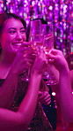 Woman, night club and toast with friends for champagne for fun, party and new year celebration with music. People, fun and happy with cheers at event or disco for entertainment, dancing and festive