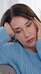 Woman, stress and face in home with headache, pain or brain fog with discomfort. Mature person, anxiety or vertigo in living room with health crisis, dizziness or tired with temple massage for relief