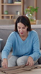 Laundry, woman and fold clothes on sofa in home for housekeeping, housework chores and morning routine. Housewife, person and packing clean linen on table for house management and cleaning apartment 