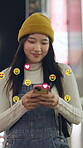 Night, Asian woman and smile on smartphone with emoji on social media, dating app or website for fun. Outdoor, female person and texting for networking, communication or connection with overlay