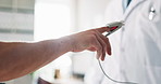 Man, finger and measure pulse in clinic, medical tool and easy examination of blood pressure. Doctor, healthcare and equipment to monitor patient vital in hospital, oxygen stats and check hemoglobin