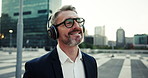 City, dance and music with business man outdoor, walking to work for commute in professional suit. Buildings, headphones and energy with mature employee person outdoor in urban town for travel
