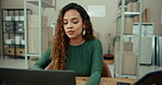 Ecommerce, laptop and logistics with business woman at desk in depot for delivery tracking. Computer, distribution and supply chain with happy African employee at work for online shopping or retail