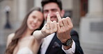 Couple, hands and fingers for wedding ring, love and marriage together with loyalty, joy and commitment. Bride, groom and people with gesture for relationship, romance and celebration at ceremony 