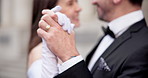 Couple, wedding and holding hands with dancing in city for celebration, excited and love on urban sidewalk. People, bride and groom with ring, happy and party with event for commitment in Spain