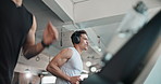Man, headphones and running on treadmill at gym with low angle, speed or music at fitness club. Person, machine or equipment with streaming, subscription and listen with workout, training or exercise