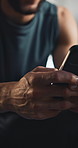Hands, fitness and man in gym with phone for exercise, training and workout for internet, chat and health app. Athlete, sports and person on smartphone for social media, website and track progress