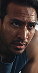 Man, tired and face in gym with sweat, fitness and exhausted from intense workout. Athlete, fatigue and closeup in training center for catching breath, wellness and challenge with resilience in break