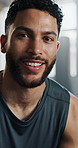 Face, man and fitness with closeup of sweat, smile and happy from exercise and training at gym. Workout, sport and portrait at wellness center with health, confidence and break of athlete from Brazil