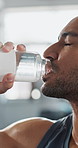 Man, sweat or drinking water in gym for fitness, tired or exhausted in intense workout. Athlete, fatigue or face closeup in training center for thirst, wellness or challenge with resilience in break