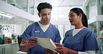 Healthcare, teamwork and nurses with document for reading, diagnosis results or medical record in clinic. Hospital, employees or discussion with patient file for information, test report or checklist