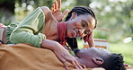 Black couple, talking and love for picnic on grass with romantic date, loyalty and bonding together. Smile, people and laughing with funny discussion, relationship anniversary and commitment outdoor