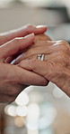 Holding hands, couple and support with ring, marriage and empathy for grief with listening for partnership. People, bonding and connection with kindness, commitment and helping with love in home