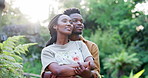 Black couple, hug and thinking in park for love, travel and bonding on vacation. Happy man, woman or outdoor with embrace for peace, holiday or engagement with shared memories in Kenya nature reserve