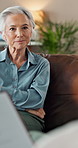 Therapy, senior woman and consultation on sofa for talking, mental health and recovery support in office. Psychology, therapist and patient with progress for counseling, feedback and notes in session