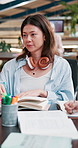 Woman, student and book with explanation for educational discussion, exam preparation and learning. Friends, people and textbook for study group, knowledge research and test assignment conversation