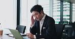Asian man, stress and laptop in office with headache, fatigue and burnout at desk. Japanese person, mature accountant or frustrated at computer with budget crisis, injury or concern for economy crash