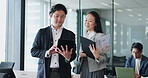 Office, tablet and Asian business people in discussion for planning project, online review and feedback. Corporate, team and Japanese man and woman on digital tech for website, research and proposal