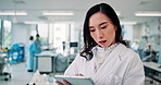 Typing, tablet and healthcare with Japanese woman in laboratory for medical school, clinical skills or report. Biotechnology, digital research and science with person in hospital for innovation study