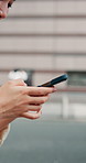 Woman, hands and phone in city for texting, networking or social media in street. Girl, Tokyo road and smartphone for online browsing, communication or chatting in urban Japan town for travel search